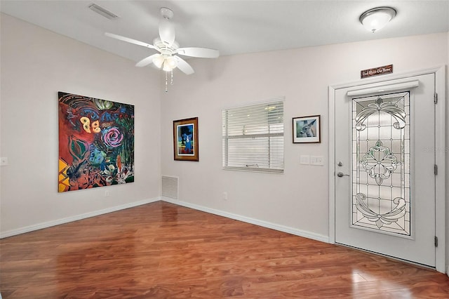 entrance foyer featuring ceiling fan, hardwood / wood-style flooring, and vaulted ceiling