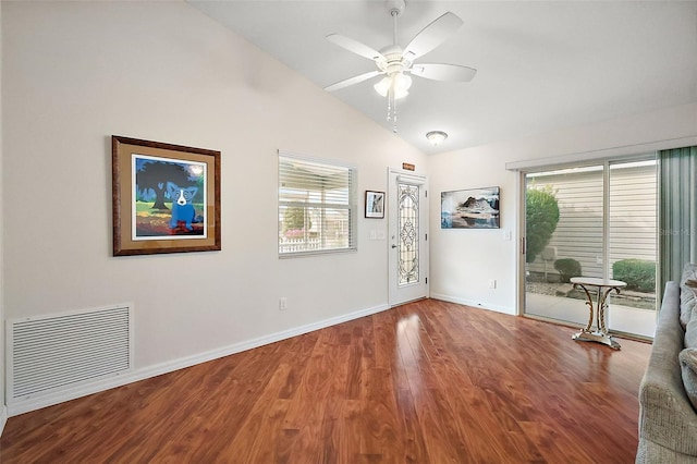 interior space with ceiling fan, hardwood / wood-style floors, and vaulted ceiling