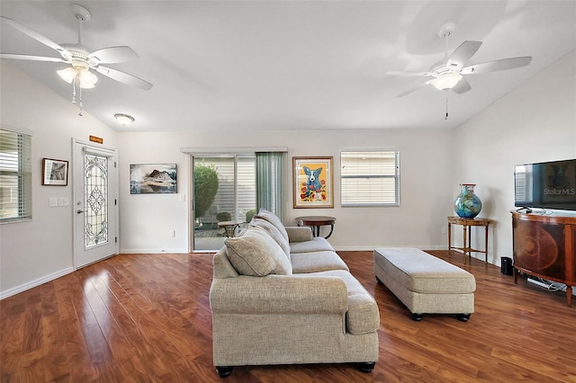 living room with ceiling fan, dark hardwood / wood-style floors, and vaulted ceiling