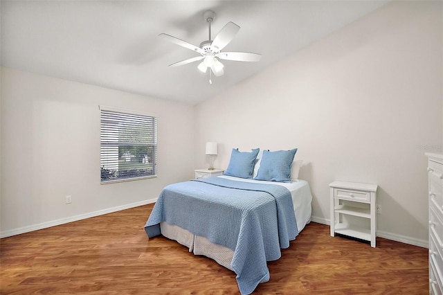 bedroom featuring ceiling fan, vaulted ceiling, and hardwood / wood-style floors