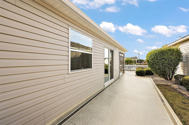 view of property exterior with a patio