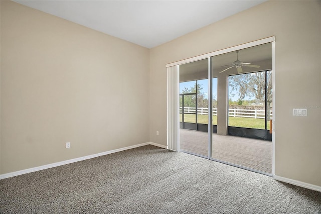 empty room featuring carpet flooring and ceiling fan