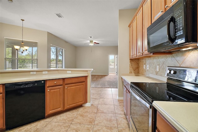 kitchen with decorative light fixtures, light tile patterned floors, black appliances, decorative backsplash, and ceiling fan with notable chandelier