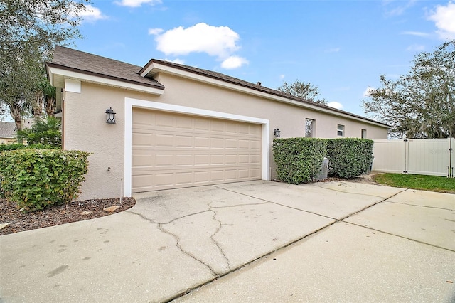 view of property exterior featuring a garage