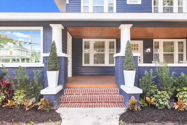 property entrance with covered porch