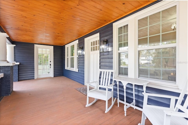 wooden terrace featuring covered porch