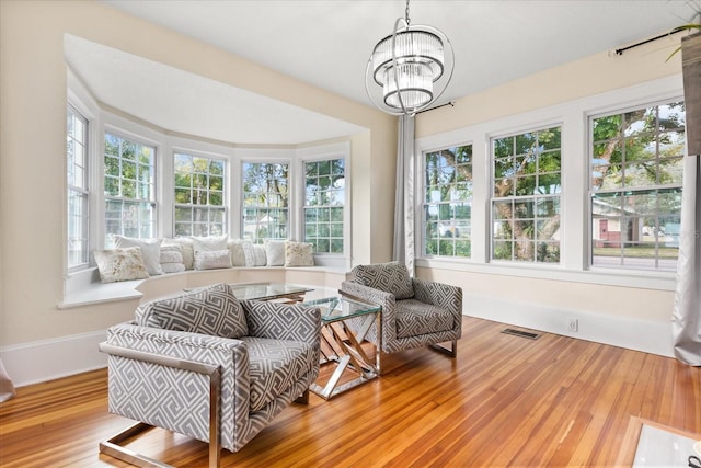 sunroom with a notable chandelier