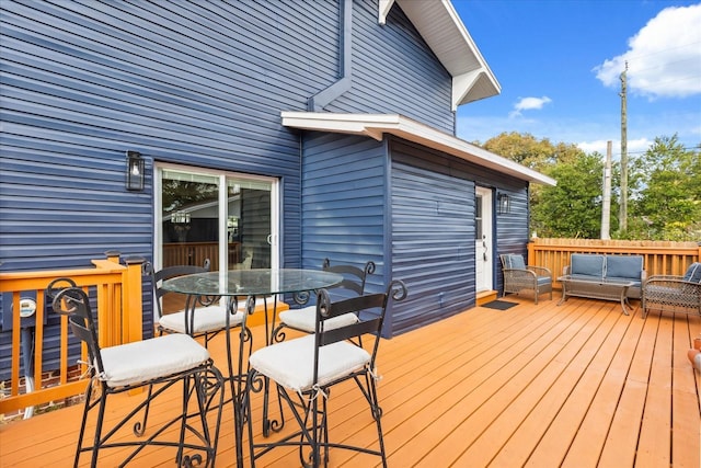 wooden deck featuring an outdoor hangout area