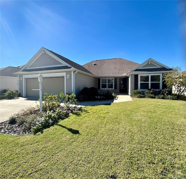 single story home featuring a front lawn and a garage