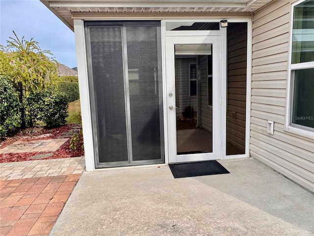 entrance to property with a patio