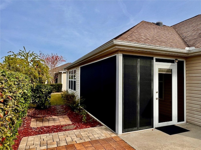 view of side of property with a patio