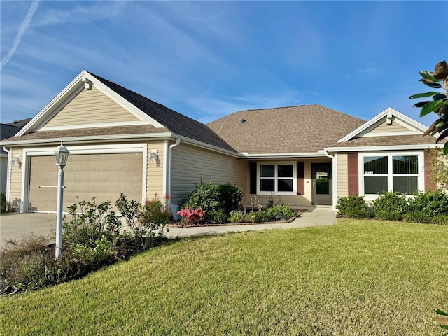 ranch-style home with a garage, concrete driveway, a front yard, and a shingled roof