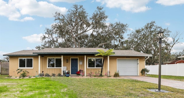 ranch-style home with a front yard and a garage