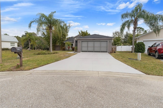 single story home featuring a front yard and a garage