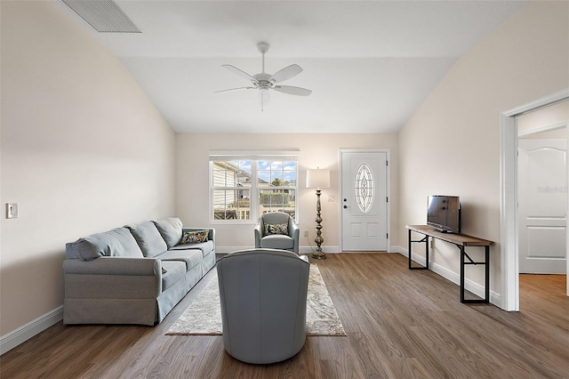 living room featuring ceiling fan, lofted ceiling, and hardwood / wood-style floors