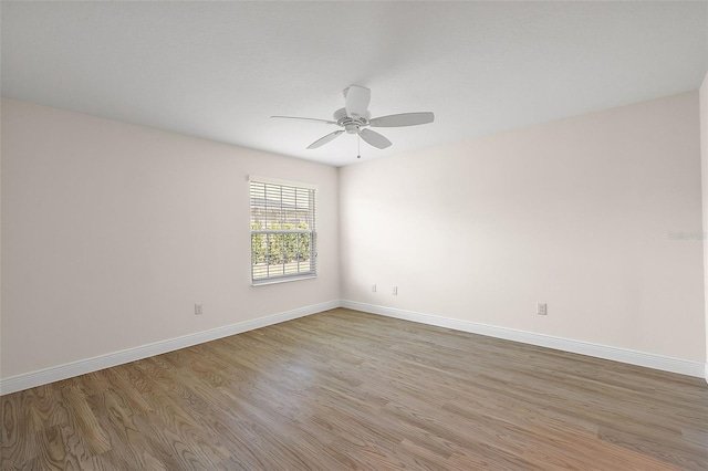 unfurnished room with ceiling fan and light wood-type flooring