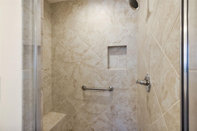 bathroom with tiled shower