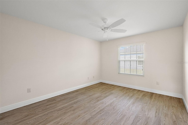 spare room featuring ceiling fan and light hardwood / wood-style floors