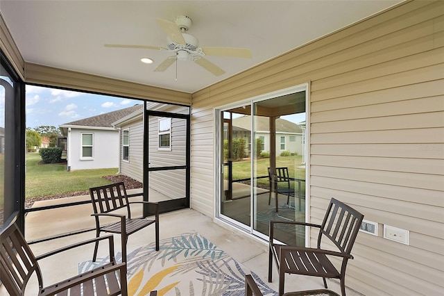 sunroom with ceiling fan