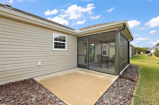 view of patio featuring a sunroom