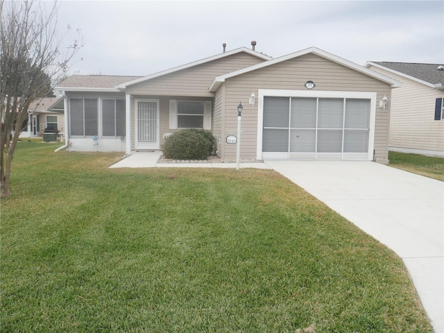 ranch-style house with a garage and a front lawn