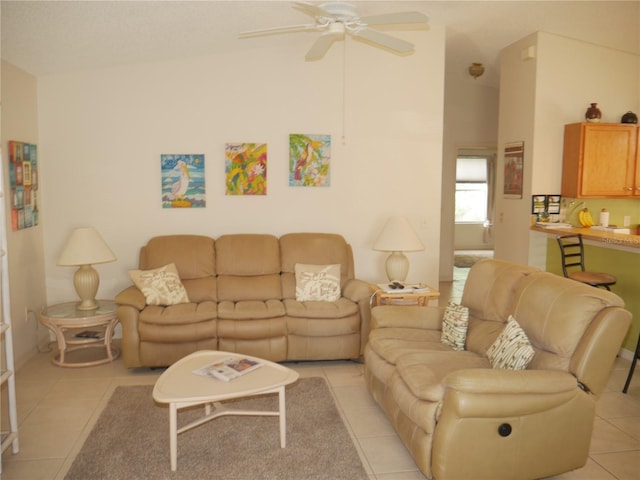 tiled living room with ceiling fan