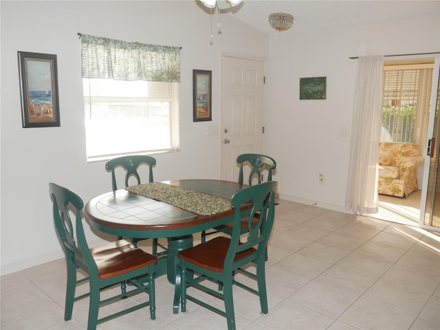 dining space featuring light tile patterned floors