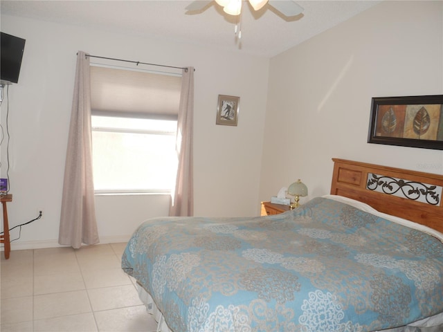 bedroom featuring ceiling fan and light tile patterned floors