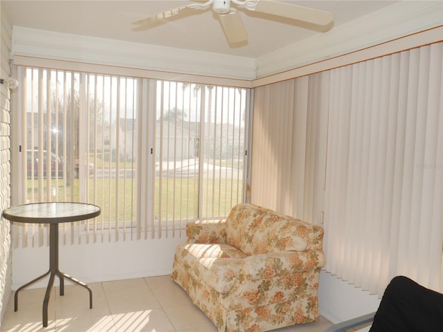 sunroom / solarium featuring ceiling fan