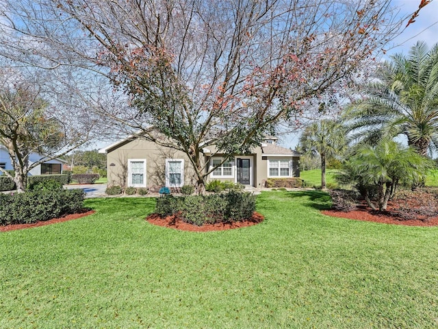 view of front of home featuring a front lawn