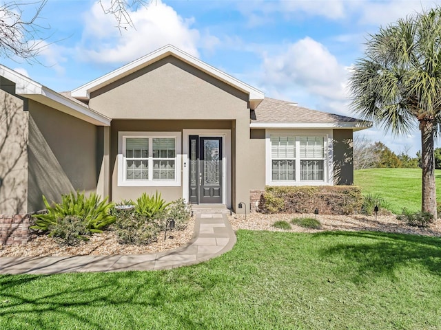 view of front facade with a front lawn