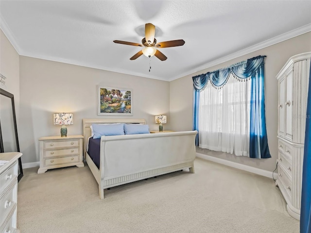 carpeted bedroom featuring ceiling fan and ornamental molding