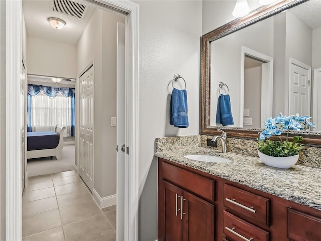 bathroom featuring vanity and tile patterned flooring