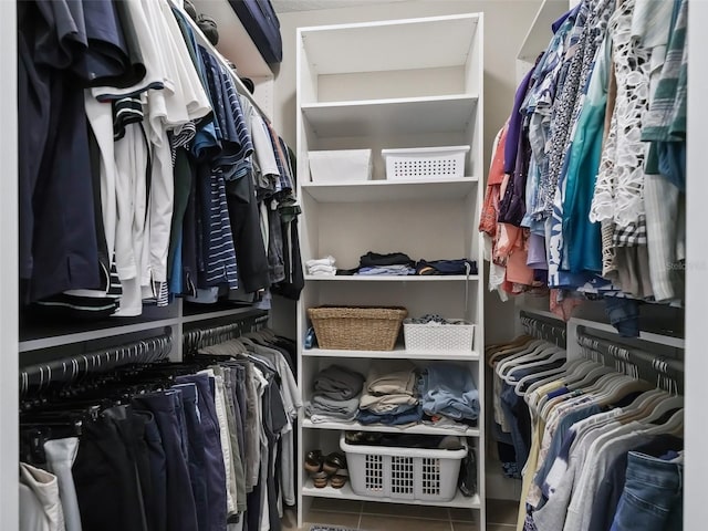 walk in closet featuring tile patterned flooring