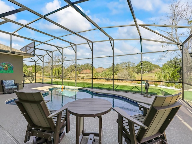 view of patio / terrace featuring glass enclosure