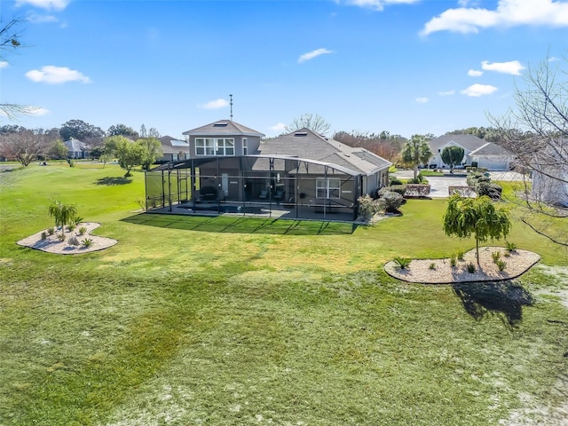 back of property with a lanai, a pool, and a yard