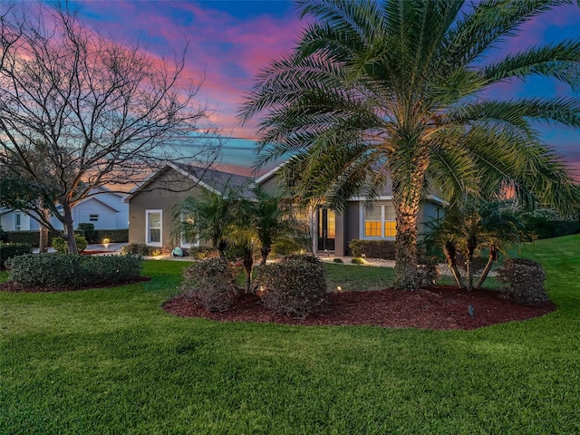 view of front of house with a lawn