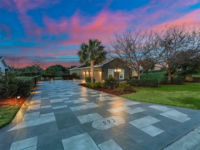 view of front of home with a yard