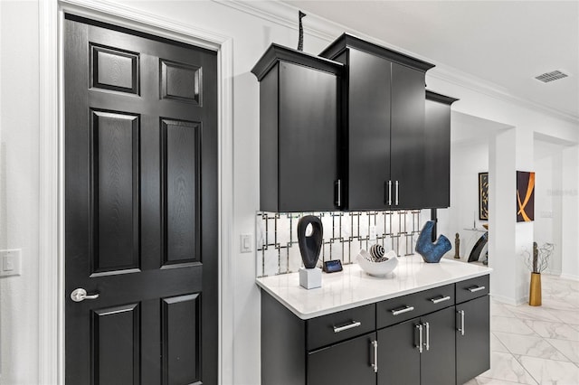 kitchen featuring crown molding