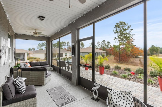 sunroom / solarium with ceiling fan