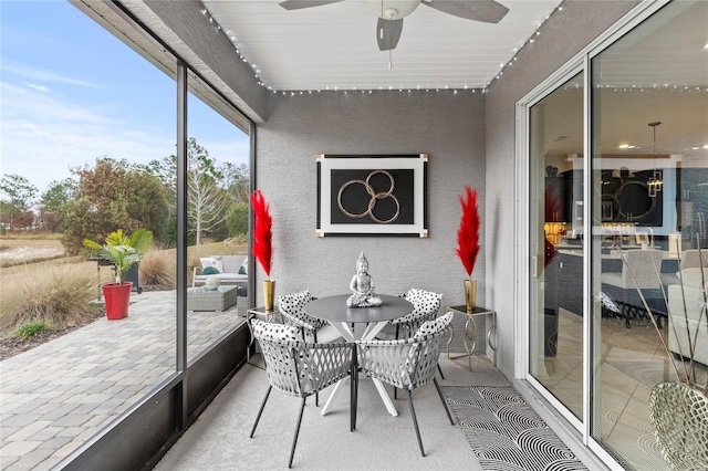 sunroom / solarium with ceiling fan