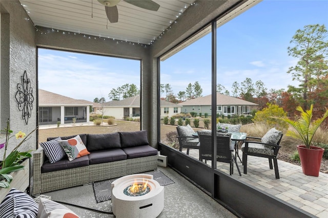 sunroom / solarium with ceiling fan