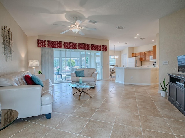 living room with ceiling fan and light tile patterned floors