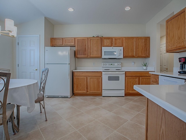 kitchen with white appliances and light tile patterned floors