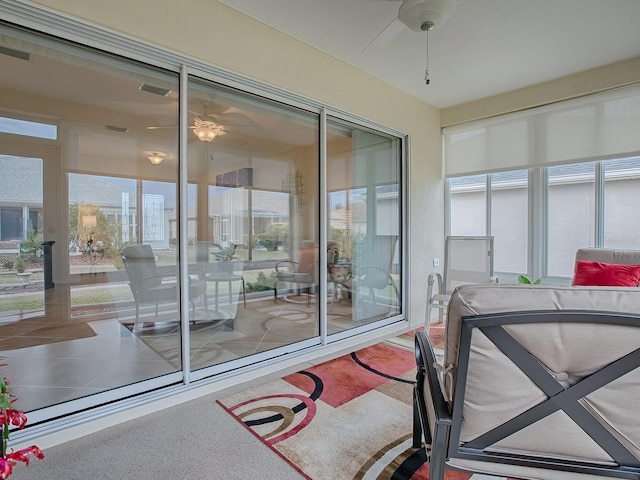 interior space featuring ceiling fan