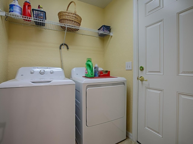 laundry area with washer and clothes dryer