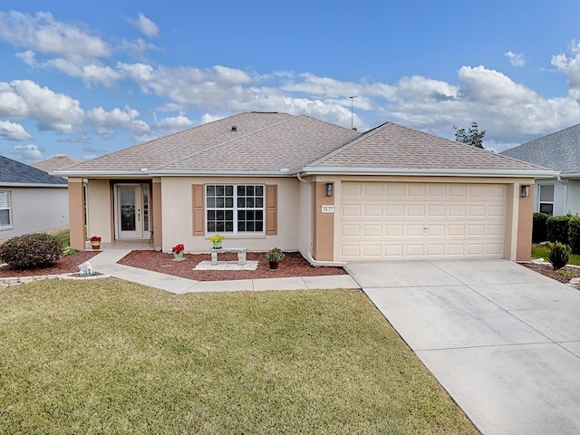 ranch-style home with a front lawn and a garage