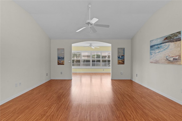 unfurnished living room featuring lofted ceiling, light hardwood / wood-style floors, and ceiling fan