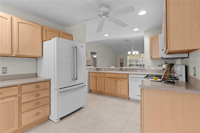 kitchen featuring ceiling fan with notable chandelier, white appliances, sink, and light brown cabinets