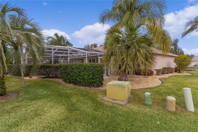 view of yard with a lanai